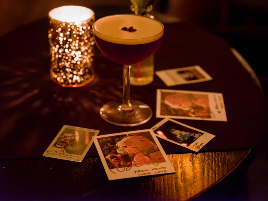 A scattering of chekis from From Minto with Love, surrounding a glass of alcohol. A scattering of chekis from From Minto with Love, surrounding a glass of alcohol.